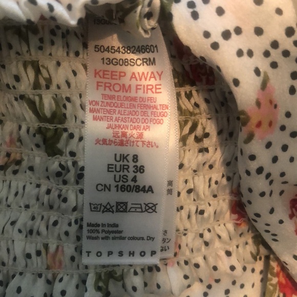 Topshop blouse from Nordstrom. US 4. Floral button front with tie bottom detail. - Picture 4 of 7